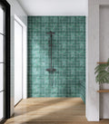 Modern bathroom with green tiled wall and wooden floor