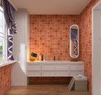 Bathroom with red tiled walls, white vanity, and a window with purple curtains.