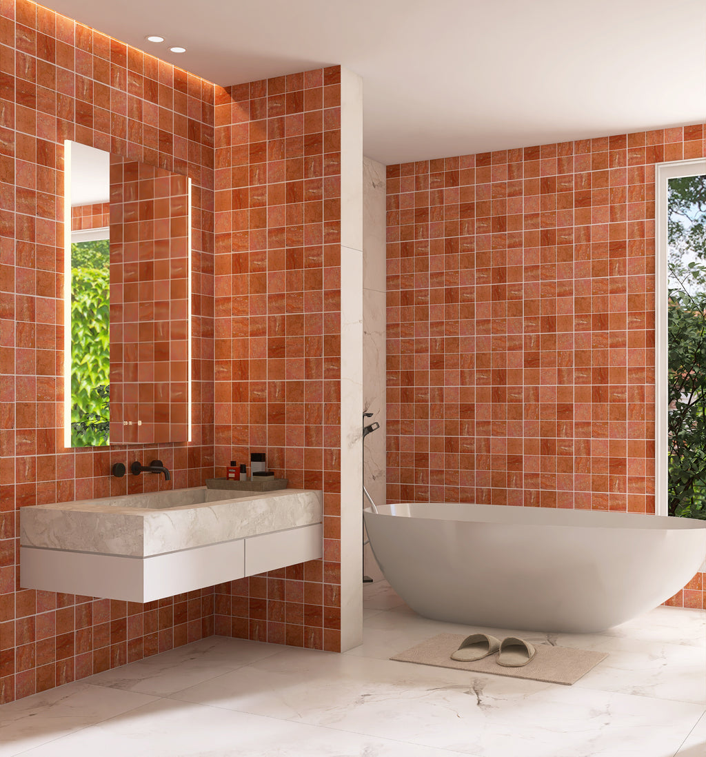 Modern bathroom with red tiled walls, white fixtures, and a large mirror.