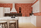 Modern kitchen with red tiled wall, white cabinets, and wooden floor.