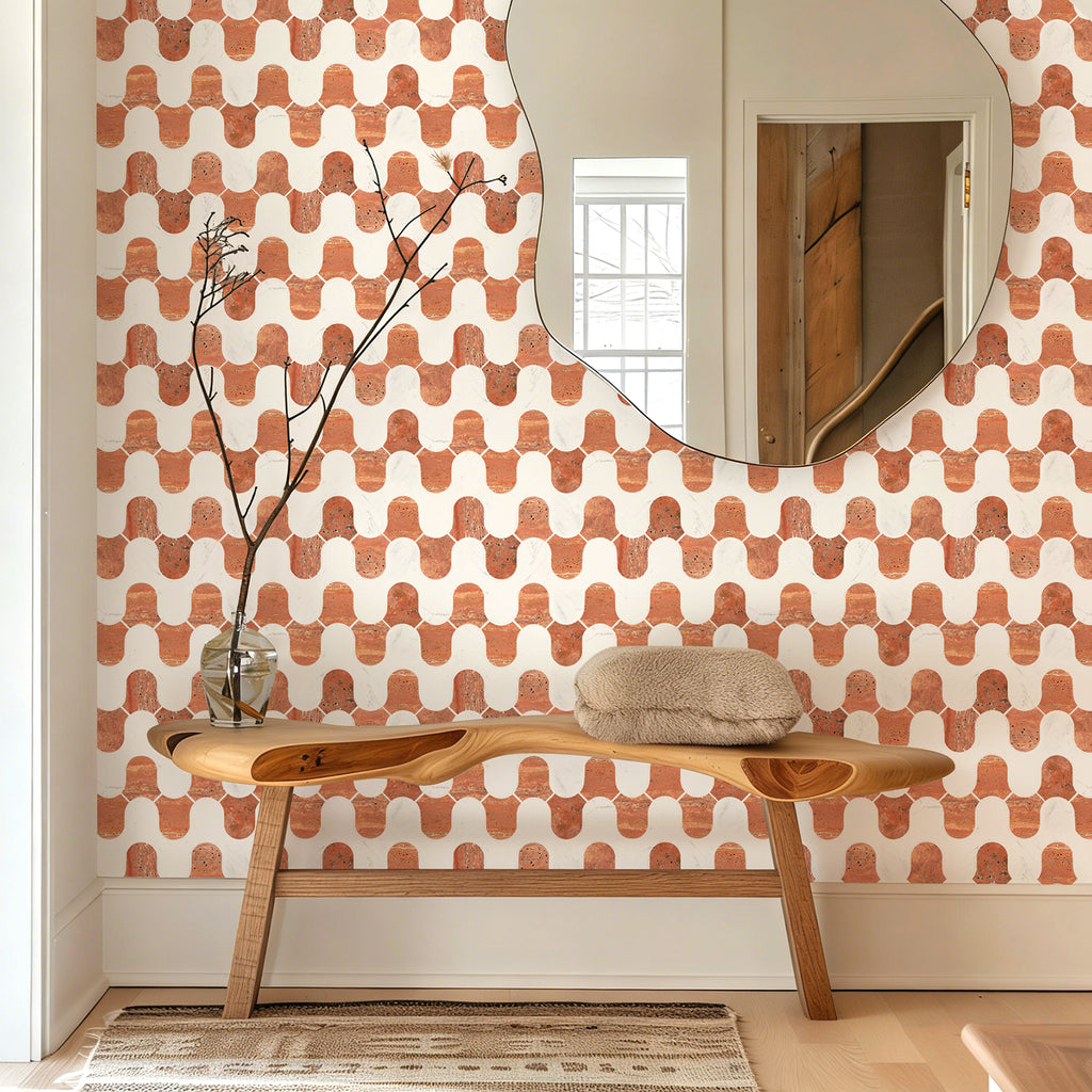 Room interior with a wooden bench, mirror, and patterned wall.