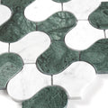 Close-up of green and white mosaic tiles on a white background