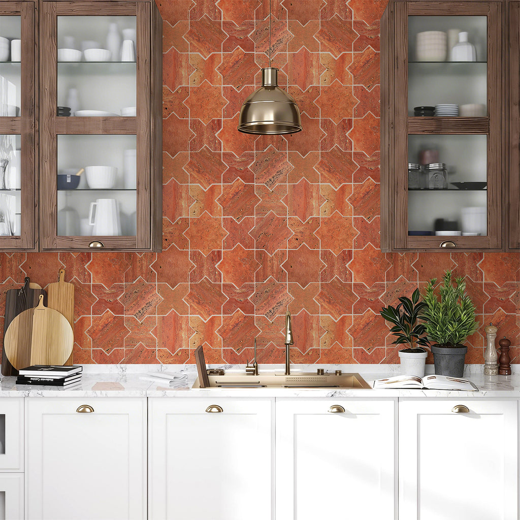 Modern kitchen with red patterned backsplash, white cabinets, and decorative elements.