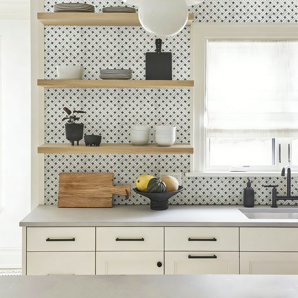 Modern kitchen with mosaic tile backsplash, wooden shelves, and white cabinets.