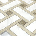 Close-up of a patterned tile with beige and brown squares on a white background