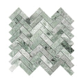 Green marble mosaic tile herringbone pattern on a white background