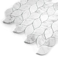 White carrara marble mosaic tiles with leaf-shaped patterns on a white background