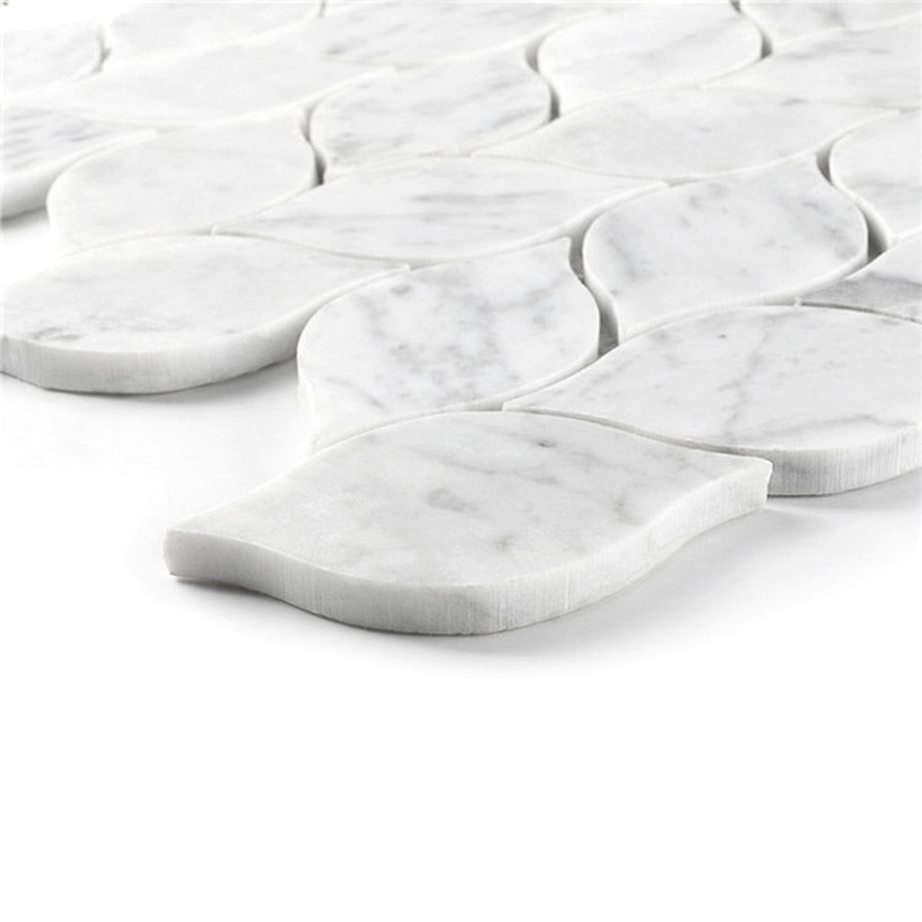 White carrara marble tiles arranged in a leaf-pattern on a white background