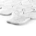 White carrara marble tiles arranged in a leaf-pattern on a white background