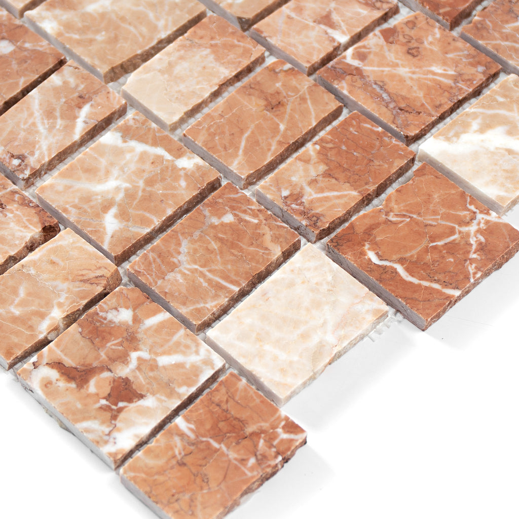 Close-up of brown and beige marble tiles on a white background