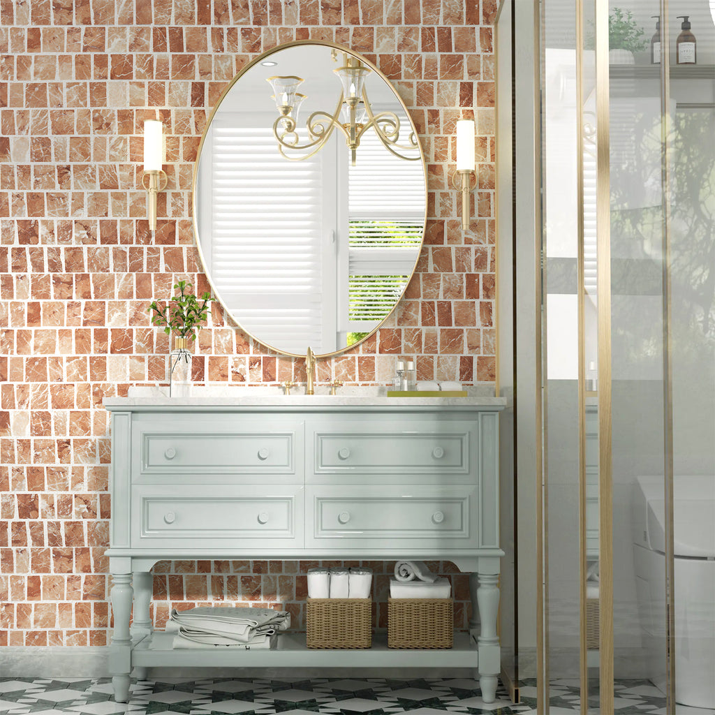Bathroom vanity with round mirror against a tiled wall