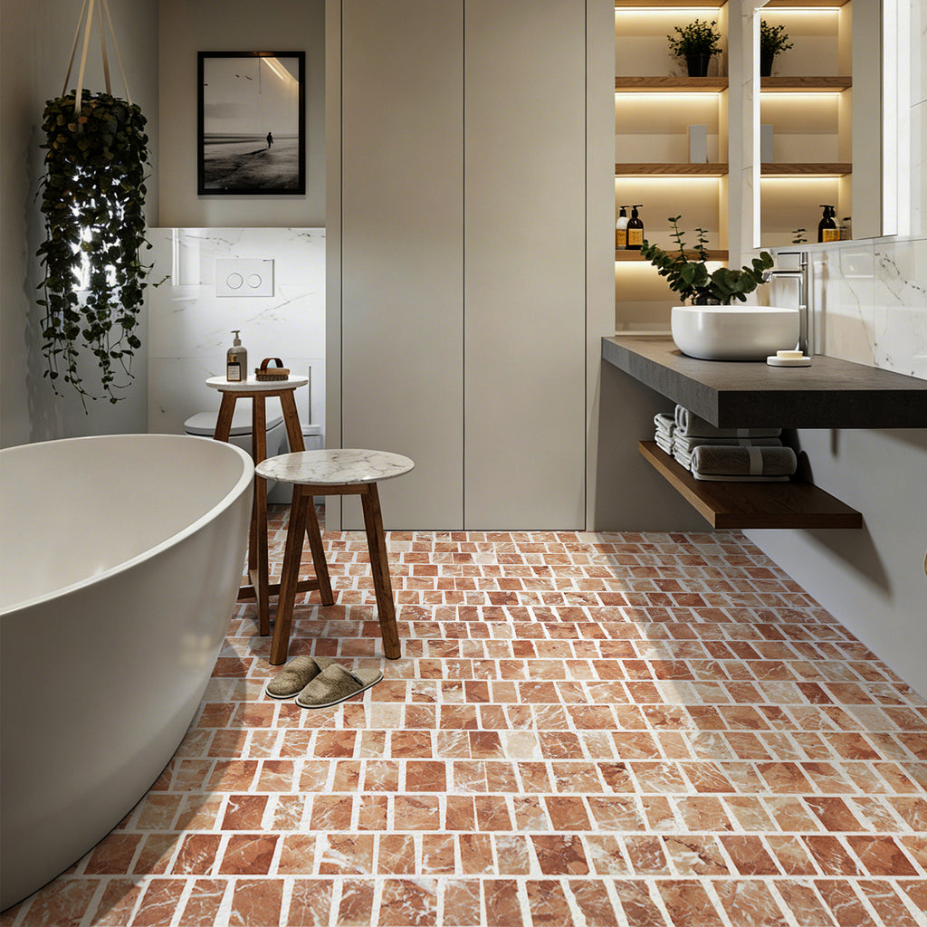 Modern bathroom with freestanding bathtub, tiled floor, and wooden stool.