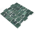 Green mosaic tile pattern on a white background
