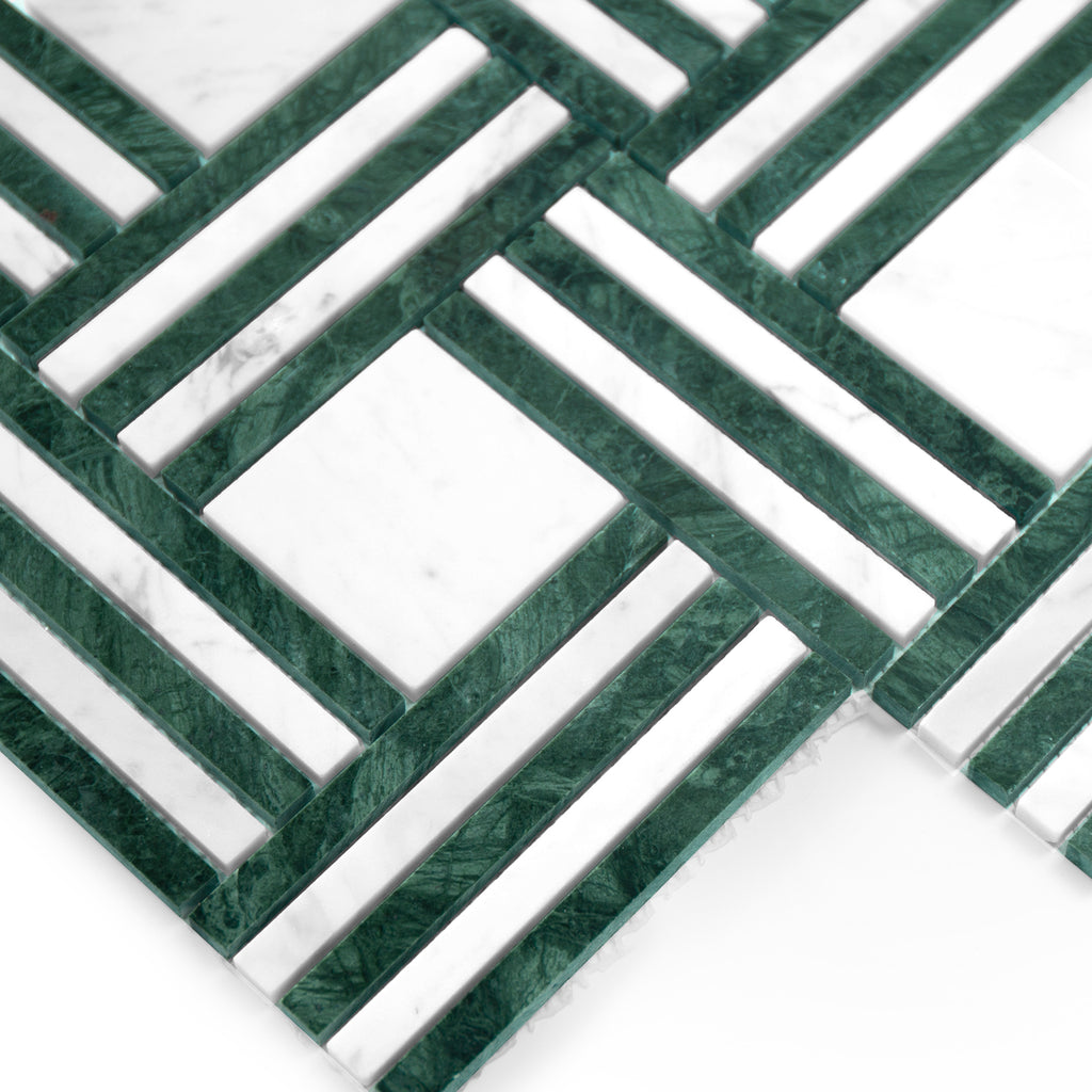 Geometric pattern of green and white tiles on a white background