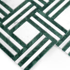 Geometric pattern of green and white tiles on a white background