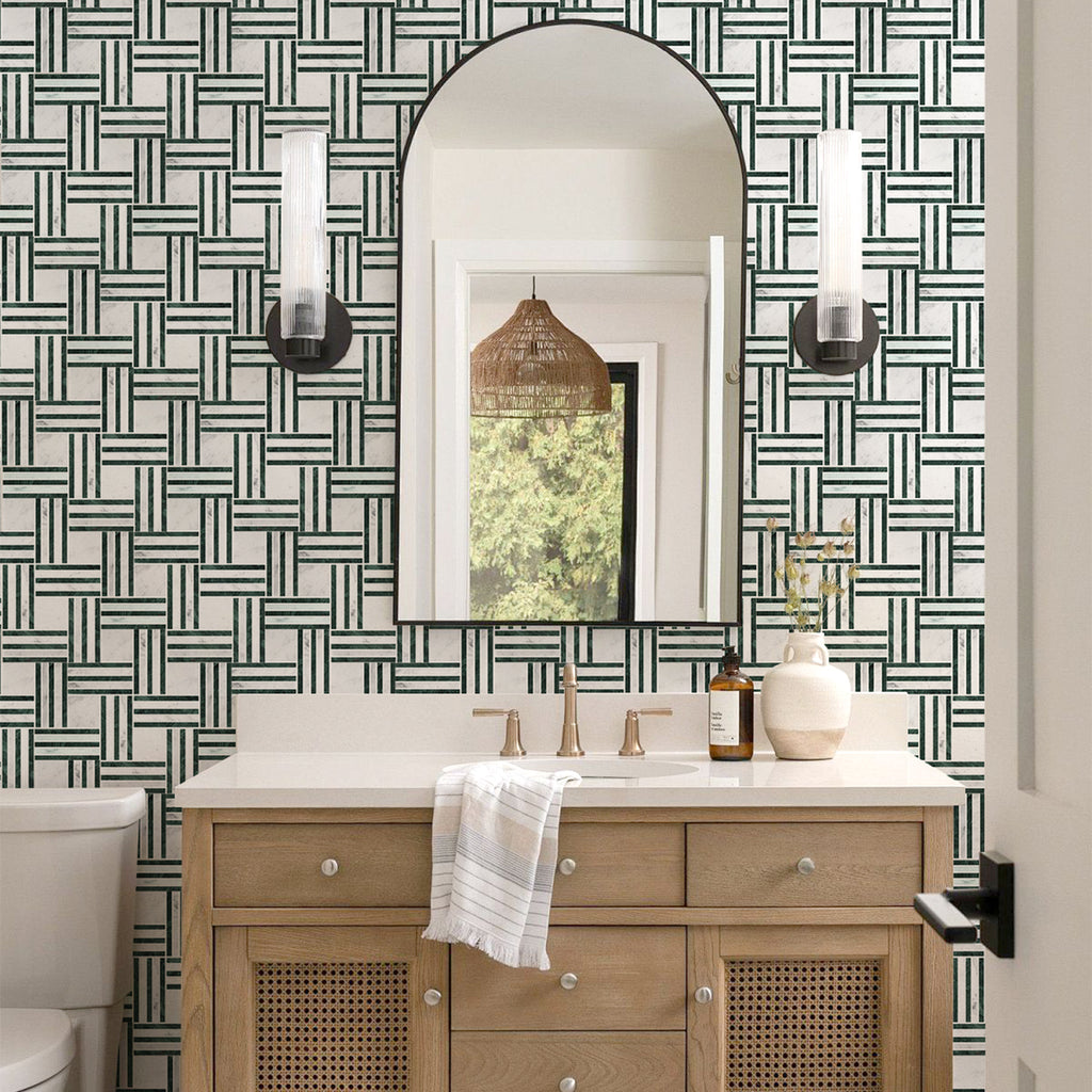 Bathroom with wooden vanity, mirror, and geometric wallpaper