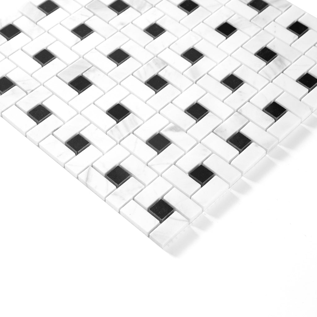 Black and white mosaic pinwheel tile pattern on a white background