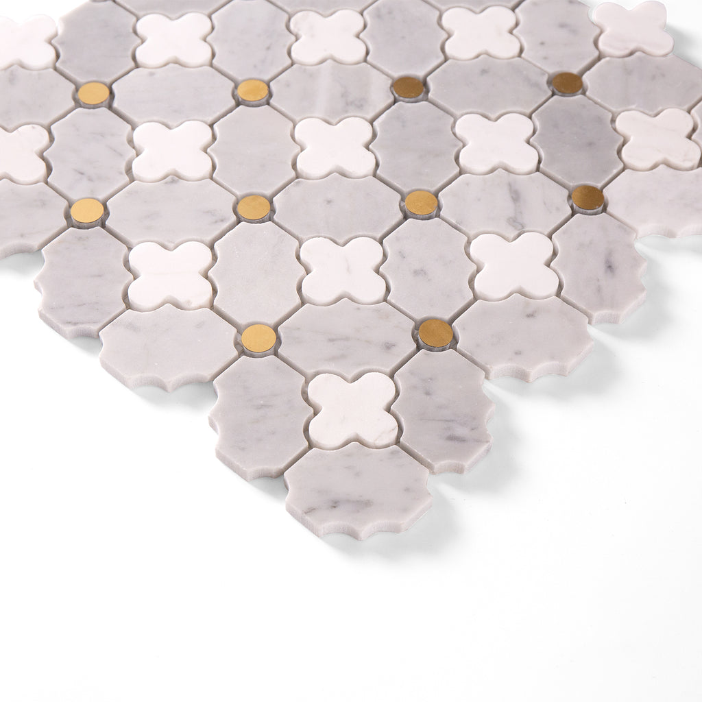 Hexagonal mosaic tiles with a mix of gray, white, and gold colors on a white background.