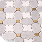 Close-up of hexagonal tiles with white and gold patterns