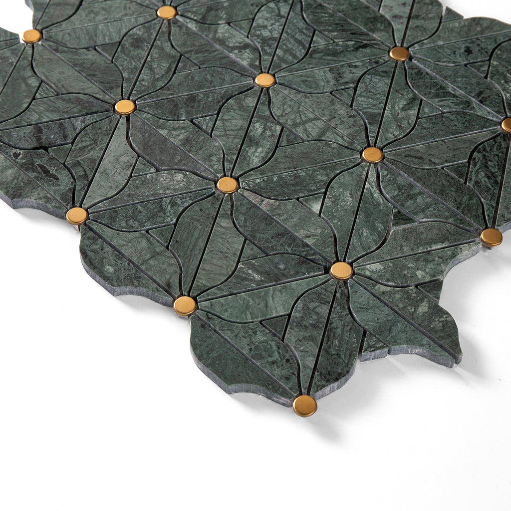 Decorative stone tile with leaf pattern and gold accents on a white background