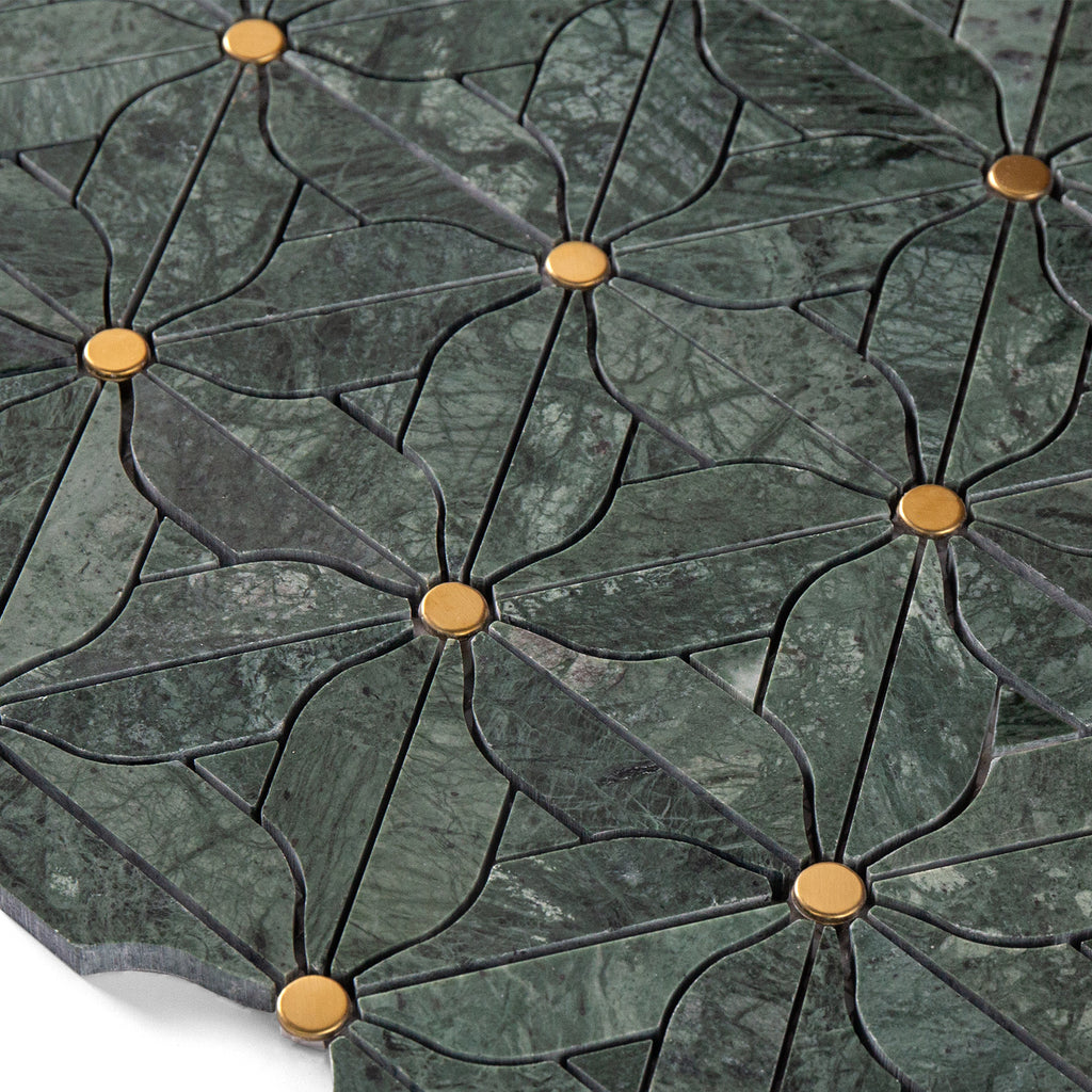 Close-up of a green marble tile with gold accents
