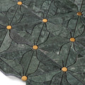 Close-up of a green marble tile with gold accents