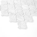 White carrara surface with a arabesque pattern on a white background