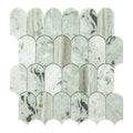 Marble mosaic tile with scalloped edge design on a white background