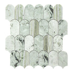 Marble mosaic tile with scalloped edge design on a white background