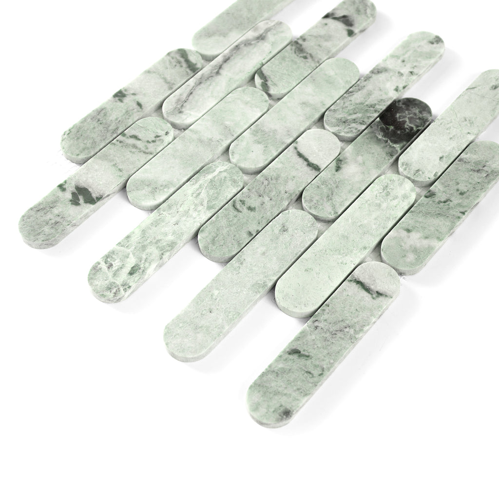 Green marble tiles arranged in a pattern on a white background