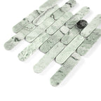 Green marble tiles arranged in a pattern on a white background
